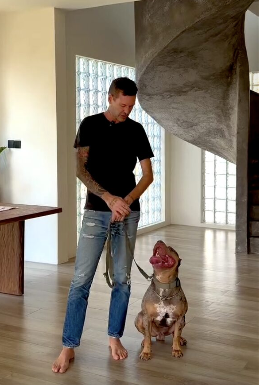 Stephan Mairesse training a dog barefoot at home